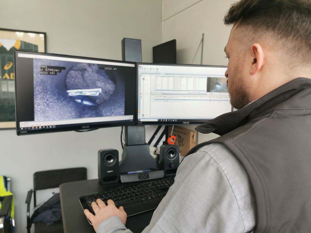 Drainrod Ltd carrying out drain survey reporting in the office in Newport