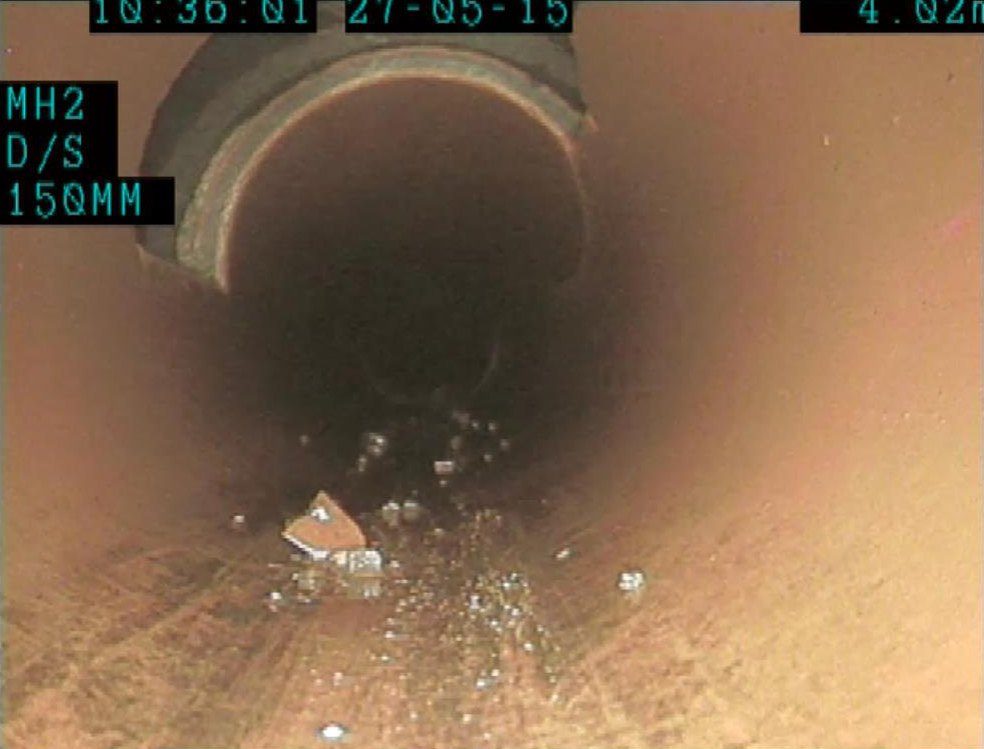 Drainrod Ltd's CCTV survey of a drain showing a section of pipe which has been cut out and requires lining in Cardiff